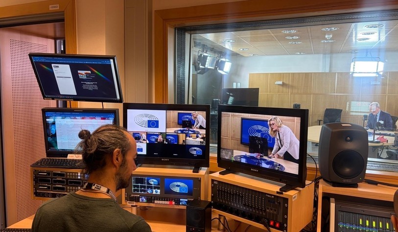 A recording studio with tv screens