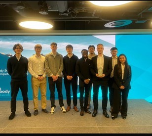 The winning team pose for a photo