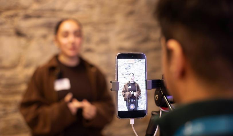 A young person is interviewed and filmed