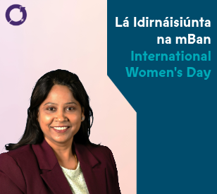 A woman in a maroon blazer smiles against a background split in pink and teal. Text: 