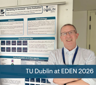 A person stands smiling in front of a research poster titled 