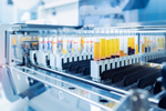 Scientist working with auto robotical machine for testing blood, modern laboratory medical equipment