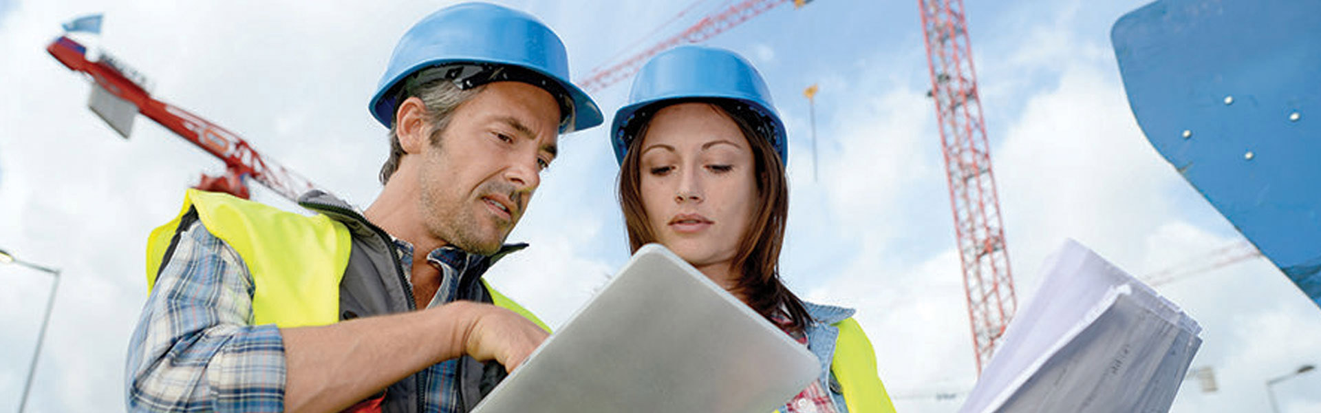 Construction students looking at documents